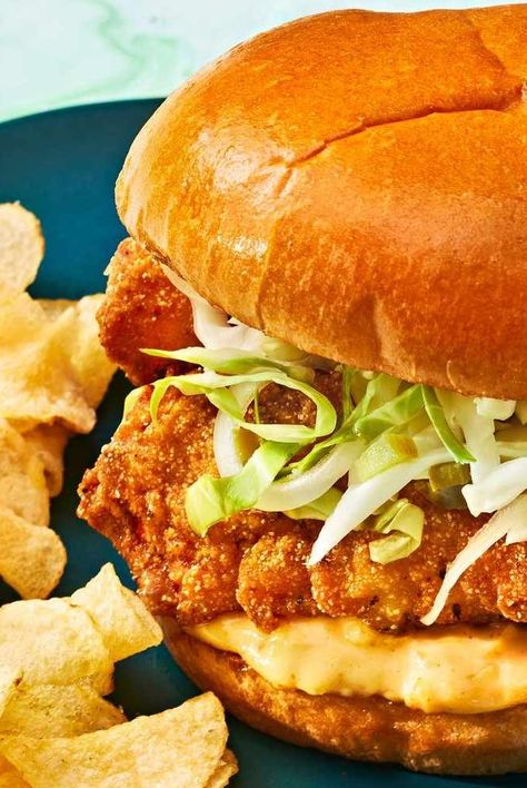 The next time you get a cracking for a beach-worthy fish sandwich, skip the drive-thru and make this recipe instead. The combination of exquisitely crispy fish, chowchow–spiked mayonnaise, spicy slaw, and buttery toasted brioche buns delivers a sandwich that no fast food joint (and few beach dives) can compete with. Choose your favorite firm, flaky fish for this recipe (or the freshest option you can find)—our favorites are grouper or mahi-mahi. A combination of buttermilk and hot sauce also infuses a tangy heat into the fish for fried fish you'll want to make on repeat. #friedfish #fishsandwiches #bestfishsandwich #southernfishsandwich #beachrecipes #freshseafood Fried Mahi Mahi Recipes, Battered Cod, Fish Sandwich Recipes, Mahi Mahi Recipes, Southern Dinner, Hearty Dinner Recipes, Fish Sandwich, Beach Meals, Dinner Party Menu