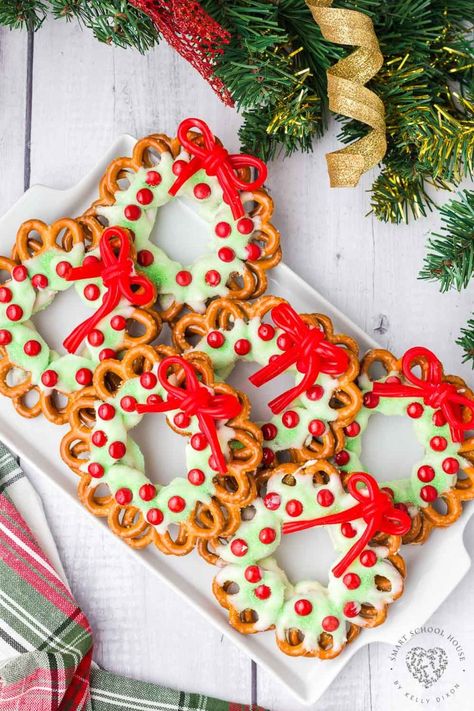 Pretzel Wreaths with a red licorice bow are an adorable and festive Christmas food craft idea! A favorite holiday treat.