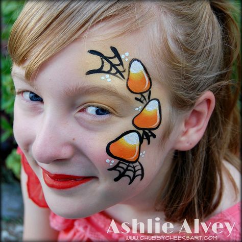 Candy Corn Cheek Art by Artist Ashlie Alvey Candy Corn Face Painting, Easy Fast Face Painting Ideas, Halloween Carnival Face Painting, Face Painting Ideas For Fall Festival, Kids Fall Face Painting Ideas, Cheek Art Halloween, Pumpkin Face Paint Ideas, Easy Halloween Face Painting Designs, Thanksgiving Face Painting