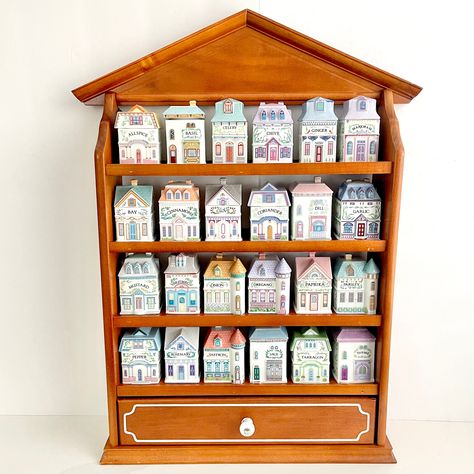 Collectible, adorable and highly sought-after spice jars and matching wooden display rack from The Lenox Spice Village collection from 1989. Each jar is made of fine porcelain, handcrafted in Taiwan. They are all marked on the bottom in golden font and some of the jars even have their original sticker on the bottom as well (see photo with bottoms displayed). The inside of each lid is marked with the type of spice! The lids also have a rubber stopper so that they sit nicely on the jar and keep it airtight. PLEASE NOTE: this listing is to purchase ONE (1) spice jar. Please select which spice jar you would like to purchase from the dropdown menu. If you would like to purchase more than one, please add each individual spice jar to your cart. A small combined shipping discount will be provided Lenox Spice Village, Spice Village, Wooden Spice Rack, College Room, Spice Containers, Wooden Display, Spice Organization, Future Apartment, Kitchen Jars Storage