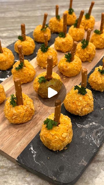 Maegan Brown ~ The BakerMama on Instagram: "Mini Pumpkin Cheese Balls 😋🧀🥨 an impressive fall appetizer that comes together in a matter of minutes! SAVE this video for the RECIPE BELOW or COMMENT “cookbook” to find it on page 211 of my Spectacular Spreads cookbook! ⬇️ #TheBakerMama #SpectacularSpreadsCookbook

Ingredients:
• 1 (8 ounce) container cream cheese (plain or pumpkin spice flavored), softened
• 1 cup shredded orange cheddar cheese
• 1/4 teaspoon pumpkin pie spice
• 1/4 teaspoon cayenne pepper
• 1/4 teaspoon paprika
• 1/4 teaspoon kosher salt
• 1/2 cup finely crushed Cheez-its crackers
• 12 pretzel sticks, halved
• 24 fresh parsley leaves

Instructions:
1. In a medium mixing bowl, stir together the cream cheese, shredded orange cheddar cheese, pumpkin pie spice, cayenne pepper, Pumpkin Cheese Balls, Pumpkin Cheese Ball Recipe, Cheese Pumpkin Pie, Pumpkin Cheese Ball, Fall Appetizers Easy, Fall Appetizer, Cheese Ball Bites, Christmas Appetizers Easy, Parsley Leaves