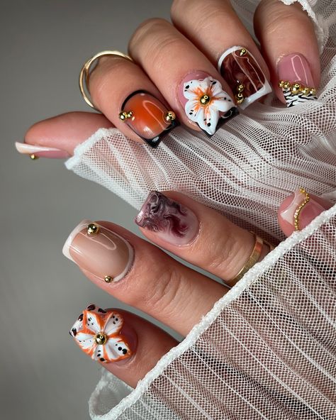 Fun fall mix and match press on nails set 🧡🦓 • • • • #nails #pressons #pressonnailbusiness #nailart #naildesign #nailartist #nailsnailsnails #businessowner #follow #like #fallnails #falldesignnails #autumn #autumnnails #designnails #nailtech #flowernails #frenchtipnails #cheetahprint #cheetahprintnails #zebraprint #zebraprintnails #auranails #brownnails #orangenails #whitenails Arizona Nail Designs, Bright Fall Nails, Fall Flower Nails, Western Fall Nails, Slay Nails, Sims Challenge, Zebra Print Nails, Cheetah Print Nails, Set Nails