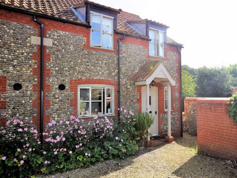 A charming flint cottage offering a family or friends the perfect holiday home, enjoying an enviable location in the village of Warham and located less than 2 miles from Wells-next-the-Sea. Flint Cottage, Wells Next The Sea, Norfolk House, Houghton Hall, Norfolk Coast, Wooden Gates, Farmhouse Exterior, Beach Hut, Most Beautiful Beaches