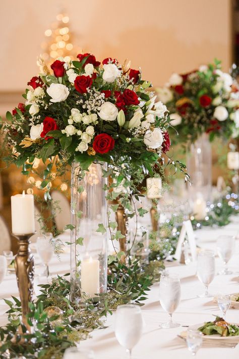 Red Winter Wedding Centerpieces, Y’all Centerpieces, Red White Green Wedding Decorations, Crimson And White Wedding, Red Rose Wedding Reception Decor, Red Rose Centrepiece Wedding, Red Tall Centerpieces, Classic Wedding Flower Arrangements, Red Blush Gold Wedding