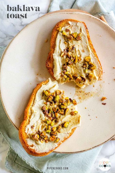 Elevate your breakfast game with this mouthwatering baklava toast! Crispy toasted bread topped with a luscious sweetened cream cheese and a blend of honey, pistachios, cinnamon, and nutmeg. A delicious way to start your day or satisfy your sweet cravings. Give it a try now! Cheese And Honey, Baklava Cheesecake, Turkish Baklava, Baklava Recipe, Avocado Toast Recipe, Toast Toppings, Toasted Bread, Cheese Toast, Sweet Cravings