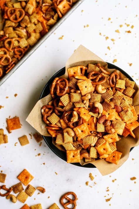 One of our favorite snacks to make for the holidays is our Slow Cooker Savory Chex Mix recipe. It is a great cereal mixture that you make with corn or rice Chex, some mini pretzels, cheese crackers, and of course unsalted butter! Caramel Bugles, Chex Mix Recipes Crock Pot, Savory Chex Mix Recipes, Soft Caramel Popcorn, Savory Chex, Savory Chex Mix, Rice Krispie Balls, Cinnamon Chex, Homemade Caramel Popcorn