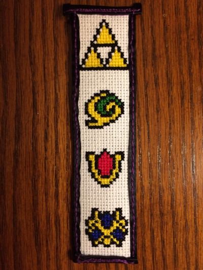 Legend of Zelda/Ocarina of Time cross stitched bookmark (pattern not mine) Ocarina Of Time Cross Stitch, Yule Stocking, Cross Stitch Free, Pixel Grid, Grid Art, Zelda Ocarina Of Time, Bookmark Pattern, Tiny Cross Stitch, Tiny Cross