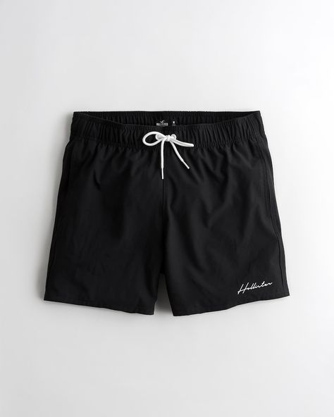 Shorter-length swim trunks that hit mid-thigh. Featuring a drawstring waistband and embroidered logo detail. Black Nylon Swim Trunks With Drawstring, Black Moisture-wicking Swim Trunks Sportswear, Sports Swim Trunks With 4-way Stretch And Drawstring, Sporty Micro-elastic Swim Trunks, Nylon Swim Trunks With Built-in Shorts, 4 Way Stretch Fabric, Drawstring Waistband, Above The Knee, Swim Trunks