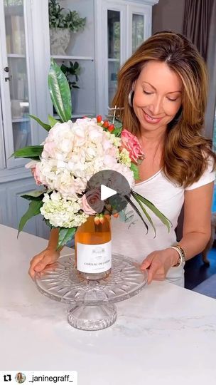 4.6K views · 329 reactions | #Repost @_janinegraff_ with @use.repost ・・・ Wine Bottle Floral Bouquet💐 What better way to receive a bottle of wine than one that is crowned with a beautiful bouquet of flowers on top! This is such an easy and elegant way to elevate your next gift to that special Mom, Bride to Be, Hostess or Birthday Gal! 💐I forgot to show you that I soaked the florist foam aqua block in water before placing on top of my bottle. I used FRESH florals but you could use faux florals too. After presenting your wine bottle arrangement, the recipient of your gift will be able to easily slide the bouquet up and off of the bottle neck and can then place it in a bowl or vase with water to enjoy for at least a week. This arrangement can be created using any type of beverage bottle Beverage Bottle, A Bottle Of Wine, Bottle Of Wine, Beautiful Bouquet Of Flowers, Bouquet Of Flowers, Faux Florals, Bride To Be, Beautiful Bouquet, Floral Bouquets