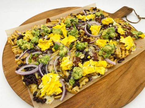 katies waffle fry breakfast nachos | Food Network Breakfast With Pancakes, Waffle Tacos, Waffle Taco, Katie Lee Biegel, Eggs In Purgatory, Breakfast Nachos, The Kitchen Food Network, Spicy Eggs, Waffle Fries