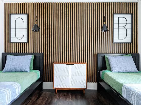 Boys room with wood slat wall and black beds. Shiplap signs and sconces were hung above each bed. Slat Walls, Wood Slat Wall, Relaxing Bedroom, Decorative Wall Panels, Painted Wall, Slat Wall, Room Remodeling, Small Wall, Boy's Bedroom