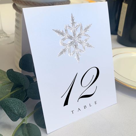 PRICES MAY VARY. Snowflake illustration printed on each table number Printed on 107# Heavyweight White Card Stock Free-standing, and Printed on Both Sides. May be used in a stand or holder by simply leaving the table number folded. Size: 4.25 inches wide x 5.5 inches tall Includes 10 Table Numbers (numbered 1-10) These table numbers feature a unique snowflake illustration at the top of each table card, and printed on a high-quality, heavyweight, white card stock. Each table number is printed on Snowflake Illustration, Table Number Stands, Printable Place Cards, Gold Table Numbers, Table Assignments, Snowflake Wedding, Wedding Numbers, Holiday Snowflakes, Table Place Cards