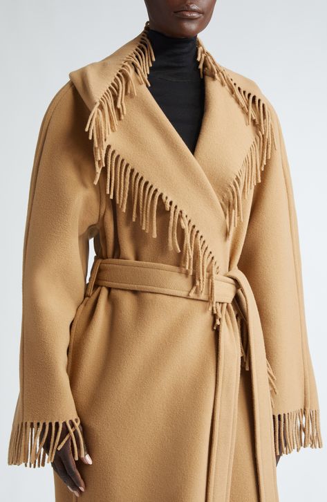 A modern take on the Western fringe jacket, this hooded wrap coat is cut from brushed double-face wool that imperceptibly becomes thick-gauge fringe. 46" length (size Medium) Open front Shawl collar Fixed hood Removable tie belt 100% wool Dry clean Made in Italy Designer Clothing Western Fringe Jacket, Hooded Wrap Coat, Wool Poncho, Fringe Jacket, Wrap Coat, Baby Cold, Hooded Coat, Double Face, Shawl Collar