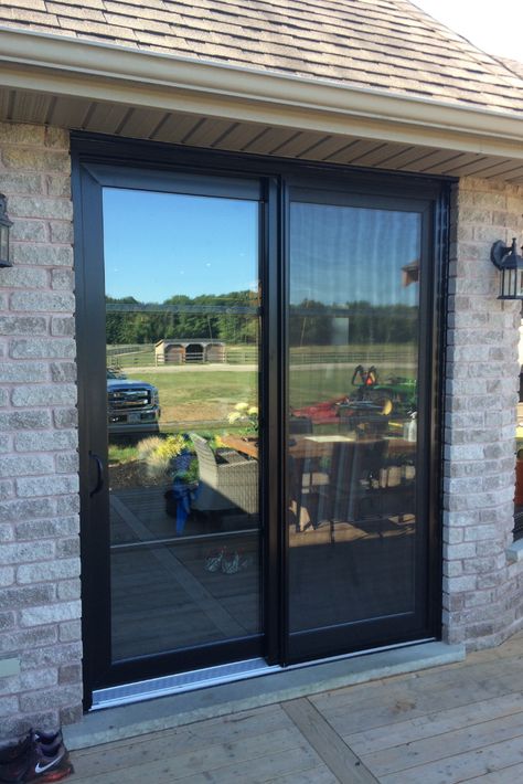 Sliding Door With Grills Patio, Glass Sliding Exterior Doors, Black Glass Windows Exterior, Black Aluminium Doors Exterior, Black Glass Window, Black Patio Doors Sliding, Black Sliding Glass Door Patio, Painting Sliding Glass Doors Black, Glass Sliding Doors Exterior