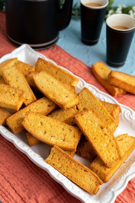 This tea-time snack is very popular in Pakistan and India. Once you bake cake rusk at home, you will never buy them from the store.Today, I am going to share a unique recipe from my homeland, Pakistan. It is the recipe of the famous cake-rusks made at local bakeries. These are served as the favorite tea time snack and everyone enjoys it with a hot cup of tea. These are crunchy and crispy cookies just like the Italian biscotti. Tea Rusk Recipe, Cake Rusk Recipe, Rusk Recipe, Italian Biscotti, Matcha Cookies, Unique Recipe, Glazed Donuts, Chocolate Glazed Donuts, Crispy Cookies