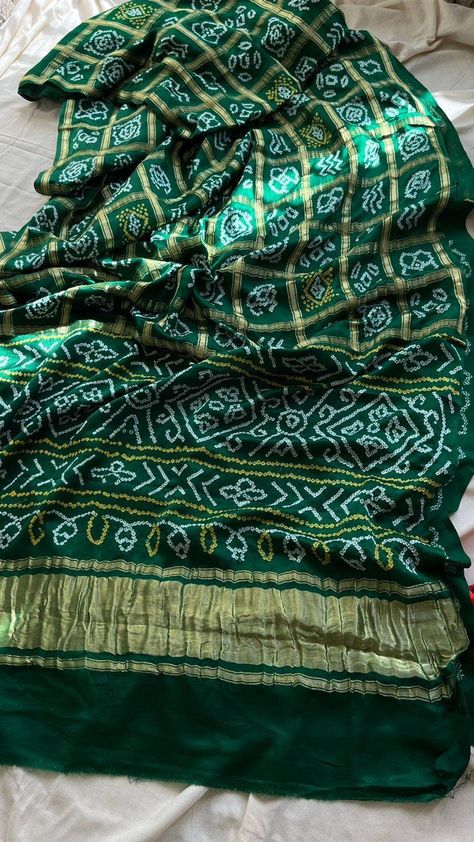 The Green Gajji Silk Saree! This gorgeous Bhandej saree is perfect for any special occasion, from rituals to traditional functions. With its Gharchola Bandhani pattern and vibrant green color, it's sure to make you stand out from the crowd. FEATURES: 🌈 Vibrant Color: This saree showcases a vibrant Green  color that will make you stand out from the crowd.  💃 Traditional Style: The traditional Bhandej pattern and Gharchola Bandhani design of this saree gives it a timeless look. 🎉 Suitable for A Gajji Silk Saree, Bandhani Design, Indian Baby Shower Decorations, Bandhani Pattern, Bollywood Sarees Online, Indian Baby Showers, Bandhej Saree, Deepika Padukone Style, Simple Sarees