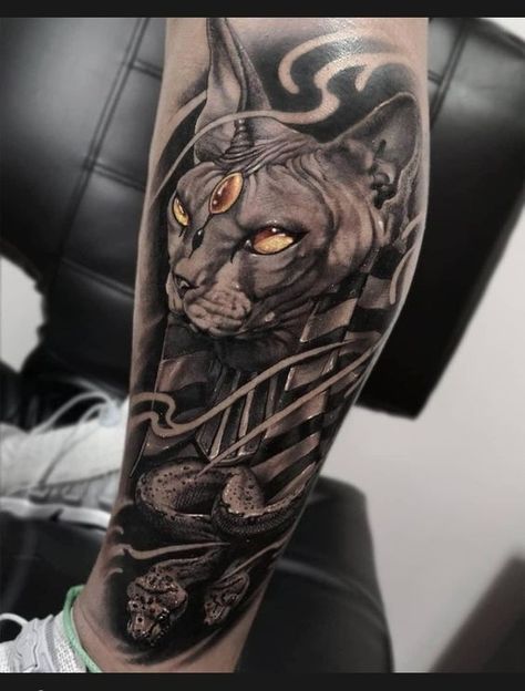 Have you been looking for a tattoo associated with myths and Ancient Egypt? In our article, you will learn who Anubis is and what unique meaning is inherent in this tattoo. Egyptian Cat Tattoos, Tattoo House, Photo Realism Tattoo, God Anubis, Black Skull Tattoo, Egyptian Tattoo Sleeve, Anubis Tattoo, Egypt Tattoo, Chicano Style Tattoo