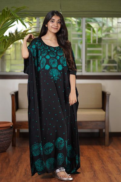 Product Description : The colour Black is a mood this rainy season, flaunt your hand block printed Dress  wherever you go. Features a Round Neck complimenting all body types. Styles that are modern with a traditional touch, making you feel rooted and proud of our heritage. Size and Fit : Model Height is 5'3" and is wearing a Size S Fit : Kaftan Fit Contents: 1. Kaftan Kaftans Dresses, Kaftan Dresses, Kind Of Blue, Indigo Shibori, Cotton Kaftan, Silk Kaftan, Rainy Season, Kaftan Dress, Printed Dress