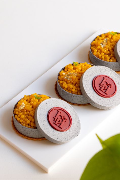 This #Tropical Caviar Box is indeed a work of art. Filled with mango #passionfruit pearls, mojito gel and white #chocolate ganache, it’s the quintessential #summer dessert. 🥭⛱️ Learn to make stunning desserts like these at École Ducasse India. Join Chef Aabhas and other expert facilitators to begin your journey as a professional pâtissier. #Masterclass #CookWithMe #PastryArts #PastryChef #Workshop Caviar Dessert, Cny Cake, Stunning Desserts, Mango Passionfruit, Dessert Box, White Chocolate Ganache, Dessert Boxes, Cake Business, Summer Dessert