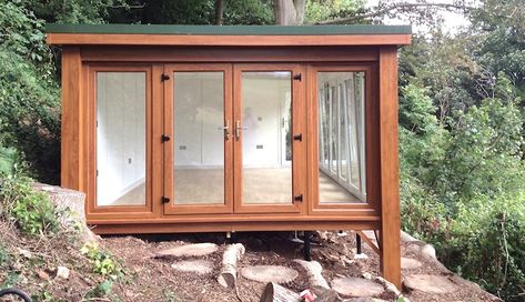 I imagine something smaller but somewhat similar to this for the shed on the slope (but with a patio on top). Shed On A Slope, Treehouse Construction, Garden Log Cabins, Backyard Cabin, Office Shed, Top Farm, Studio Shed, Tree House Kids, Sloped Garden