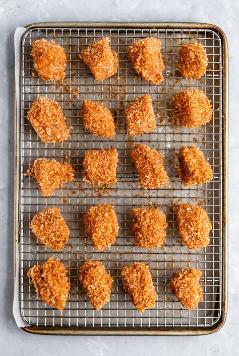 These are the BEST crispy baked chicken nuggets you'll ever make! This delicious, healthy chicken nuggets recipe takes just about 30 minutes from start to finish and uses super simple ingredients like panko breadcrumbs, chicken breast and spices. Serve with honey mustard, ketchup or your favorite BBQ sauce. Kid-friendly and adult approved! #chicken #chickennuggets Healthy Chicken Nuggets, Chicken Nuggets Recipe, Frozen Chicken Nuggets, Baked Chicken Nuggets, Homemade Chicken Nuggets, Chicken Nugget Recipes, Healthy Baked Chicken, Nuggets Recipe, Crispy Baked Chicken