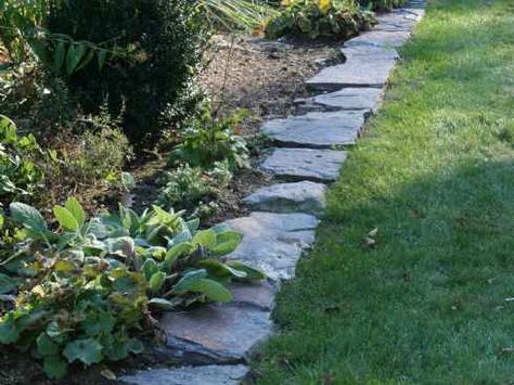 Fieldstone Garden Path. Garden Path Stone is a fieldstone with moss and lichen which gives this stone a weathered, rustic appearance. Subtle earth tone colors range from gray, brown, green, and burnt umber. Garden Path Stone is ideal for casual walkways, patios and paths and makes a beautiful, natural edging for gardens, lawns or driveways. Landscaping Edging, Yard Edging, Land Scaping, Stone Paths, Stone Garden Paths, Rock Border, Brick Pathway, Outdoor Renovation, Slate Wall