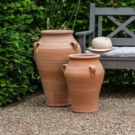 Pithos terracotta pot.    Individually handmade in Crete 50-year frost-proof guarantee (see below) Includes drainage hole A classic, substantial pot with real presence. This handled terracotta pot is ideal for bringing some ‘wow’ factor to the garden. Like our Crocus Collection oil pots the Pithos looks a treat with ferns or small plants spilling out over the rim. With a little ingenuity it makes a very attractive water feature too.  Modelled on traditional clay vessels used to store wine, olive Large Terracotta Pots Outdoor, Bulb Planting Tools, Terra Cotta Pots Garden, Large Terracotta Pots, Clay Vessels, Crocus Bulbs, Planting Tools, Daffodil Bulbs, Bulbs Indoor