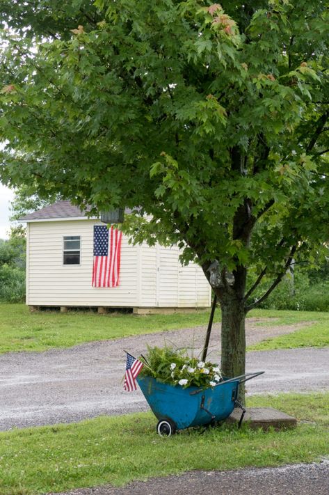 Patriotic Chicken Coop and Garden Cart - CREATIVE CAIN CABIN Chicken Coop And Garden, Vinyl Siding Hooks, Red White And Blue Decor, White And Blue Decor, Chicken Coop Garden, Circle Drive, 4th Of July Decor, Garden Cart, Cart Decor