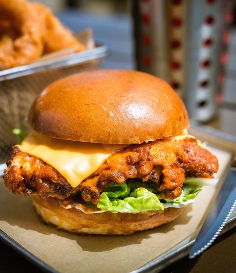 BUFFALO CHICKEN BURGER. BUTTERMILK FRIED CHICKEN BREAST, WING SAUCE, AMERICAN CHEESE, LETTUCE & MAYO. Buttermilk Fried Chicken Breast, Buttermilk Chicken Burger, Buffalo Chicken Burgers, Buffalo Burgers, Food Trolley, Fried Chicken Burger, Blue Cheese Sauce, Kfc Chicken, Menu Food