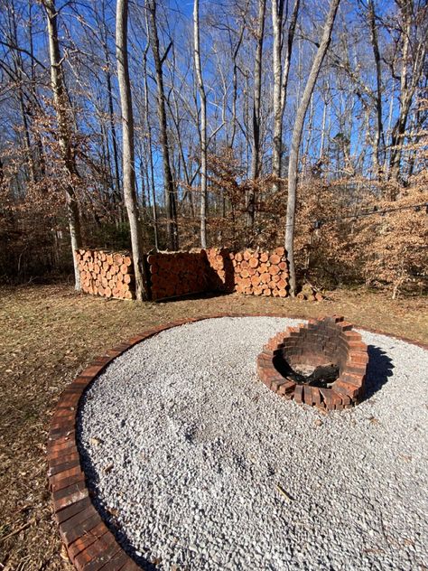 We had trees that had fallen on our property and built a privacy wall by the fire pit we built in the backyard. Loving the fire pit surrounded by rocks and brick and the walls of wood! Fire Pit Privacy Screen, Fire Pit Privacy Wall, Arborvitae Around Fire Pit, Lattice Privacy Screen Fire Pit, Fire Pit Spark Screen, Privacy Walls, Backyard Living, Fire Pit, Stepping Stones