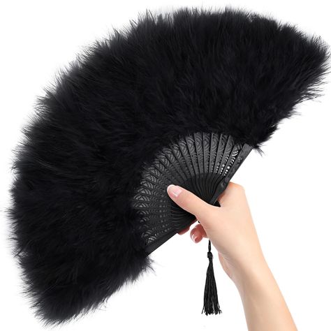 PRICES MAY VARY. Versatile Applications - From weddings and dance performances to tea parties and masquerade balls, these feather hand fans are the perfect accessory for any occasion. Their versatility extends to serving as stunning room decorations and captivating photo props, adding a touch of elegance to any setting. Exquisite Design - Enhanced by delicate tassels, these fans boast a lively aesthetic that is sure to turn heads and make you the center of attention wherever you go. Natural & Hy Victorian Masquerade Ball Decorations, Mascarade Ball Decor, Masquerade Ball Table Decorations, Roaring 20s Backdrop, Phantom Of The Opera Party Decorations, Black Party Aesthetic, 1920 Party Decorations, Black Tie Party Decorations, Hand Fan Aesthetic