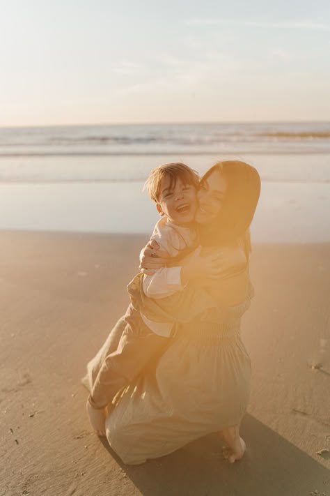 mom and son hugging during sunrise on the beach Mommy Me Beach Photos, Mother Son Beach Photoshoot, Mother And Son Beach Photos, Mom And Son Beach Photo Ideas, Mother Son Beach Photos, Mom And Son Beach Pictures, Beach Mom Aesthetic, Soulmate Photos, Jenny Billingham