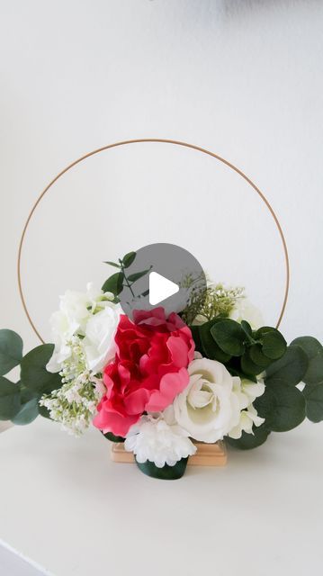 Party like Marie| Denver Florist & Event decoration on Instagram: "Wreath hoop centerpiece. Dollar tree diy #weddingcenterpiece #wreathcenterpiece #hoopwreath #wreathdecor #dollartreediy #dollartreecrafts #rustic" Graduation Hoop Centerpiece, How To Make Hoop Centerpiece, Dollar Tree Ring Centerpiece, Diy Ring Centerpiece, Hoop Floral Centerpieces, Gold Ring Centerpiece Diy, Diy Floral Hoop Centerpiece, Dollar Tree Floral Centerpiece, Metal Ring Crafts Ideas