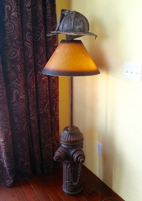 My latest creation is this Antique firefighter lamp made out of an authentic hydrant rescued from the scrap yard and antique helmet shade, ideal for a firefighter memorabilia collector. Antique fire hydrant made by Ludlow Valve Manufacturing, Co in Troy, NY patent date April 2, 1912. Authentic used Firefighter Bar, Fire Decor, Fire Truck Room, Firefighter Crafts, Fire Crafts, Truck Room, Firefighter Decor, Fire Helmet, Outdoor Fireplace Designs