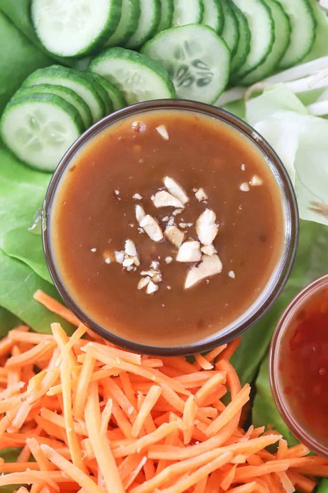 This Thai Peanut Dressing is a super easy recipe that can be used as a dipping sauce for spring rolls, drizzled over chicken or pad thai, or thinned down to make a simple Thai peanut dressing. It’s sweet, salty, tangy and only takes about 10 minutes to make. #thecarefreekitchen #peanut #sauce #asian #thai #condiment #easy #dippingsauce #dressing Pad Thai Peanut Sauce, Sauce For Spring Rolls, Thai Peanut Dressing, Lettuce Wrap Sauce, Slow Cooker Pork Ribs, Chicken Asian, Spring Roll Sauce, Easy Peanut Sauce, Slow Cooked Ribs