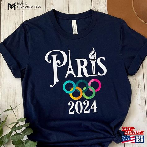 Paris 2024 Olympic Games T Shirts T-Shirt Olympics Classic Sweatshirt Check more at https://musictrendingtees.com/product/paris-2024-olympic-games-t-shirts-t-shirt-olympics-classic-sweatshirt/ Olympic Shirts Ideas, Olympic Background, Paris 2024 Olympic Games, Olympic Shirts, Olympic Crafts, Olympic Colors, Olympic Theme, Olympics 2024, Vbs 2024