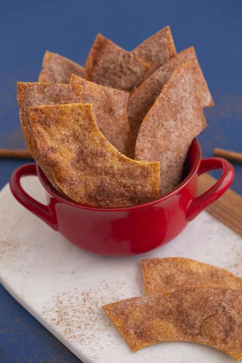 Baked Bunuelos Chips - Mind Over Munch Cinnamon Sugar Tortilla Chips, Recipe Using Tortillas, Tortilla Dessert, Bunuelos Recipe, Cinnamon Sugar Tortilla, Deep Fried Desserts, Breakfast Crunchwrap, Traditional Mexican Desserts, Crunchwrap Recipe