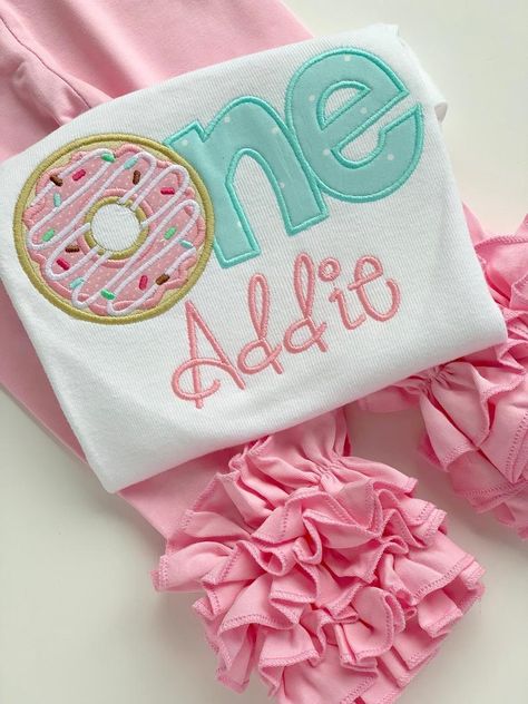 Donut first birthday shirt or bodysuit Included: shirt or bodysuit with name (note name at checkout) ::Add the matching bottoms and hairbow in the shop Birthday Girl Shirt Baby, Sweet One Donut First Birthday Decorations, Two Sweet Birthday Outfit Girl, One Year Old Donut Birthday Party, She’s A Sweet One Birthday, Donut One Year Old Party, Donut 1st Birthday Party Girl, The Sweet One First Birthday, Sweet One First Birthday Decorations