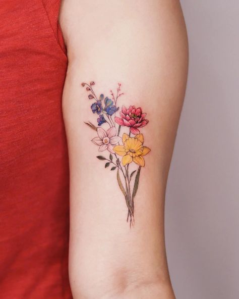 31 Beautiful Daffodil Tattoo Ideas for Men & Women in 2023 Multi Flower Tattoo, Daffodil Flower Tattoos, Tattoo Writing Fonts, Flower Tats, Tattoo Word Fonts, Tattoo Elements, Arm Wrap Tattoo, Realistic Flower Tattoo, Flower Bouquet Tattoo