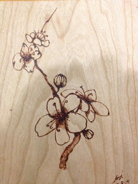 My first attempt at wood burning. Sakura ( Japanese Cherry) blossoms on cherry wood. Cherry Blossom Wood Burning, Wood Burn Flowers Design, Wood Burning Flowers, Wood Burning Designs, Cover Wood Paneling, Wood Burning Projects, Burning Flowers, Rustic Wood Projects, Sakura Japanese