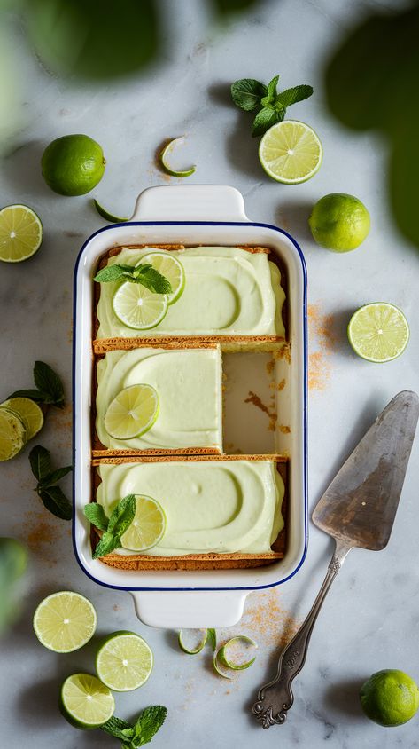 Overhead shot of key lime icebox cake in white dish on marble countertop, surrounded by fresh limes, mint leaves and vintage spatula. Lime Icebox Cake, Mexican Wedding Cake Recipe, Key Lime Icebox Cake, Oreo Donuts, Key Lime Filling, Corn Cupcakes, Pumpkin Fudge, Lime Desserts, Icebox Cake Recipes