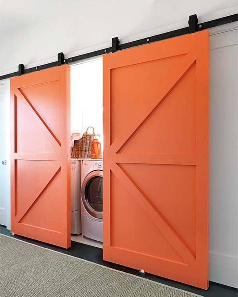 One Kindesign Door Ideas For Small Spaces, Hidden Laundry Rooms, Laundry Room Stackable, Laundry Room Storage Shelves, Hidden Laundry, Small Laundry Room Organization, Barn Door Closet, Stackable Washer And Dryer, Laundry Room Closet