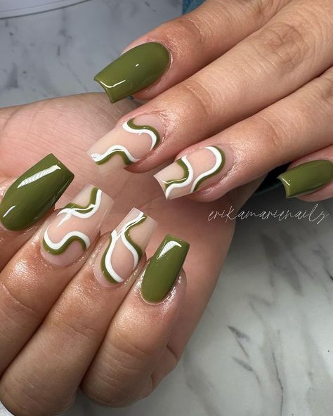 Army crawl your way to the nail salon to get army green nails because you'll feel like your MIA if you don’t get these cool, and trendy designs on your fingers. Click the article link for more photos and inspiration like this // Photo Credit: Instagram @erikamarienails // #armygreenacrylicnails #armygreenmattenails #armygreennaildesign #armygreennaildesigns #armygreennailpolish #armygreennails #greennails Green Short Nails With Design, Green And White Nail Designs Short, Green Nails Ideas Coffin, Fall Green Nails 2024, Short Olive Green Nails Designs, Short Nails Green Design, Olive Green Nails Short, Army Green Nails With Design, Hunter Green Nails Acrylic