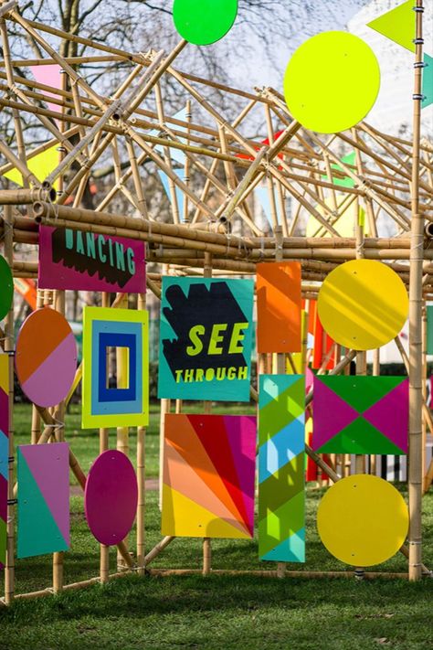 New London Fabulous designer Morag Myerscough has built a bamboo pop-up pavilion decked in colourful flags and posters in London’s Grosvenor Square. See Through Pavilion straddles a path through the leafy public park and is a cheerful intervention for the pandemic age. Photo: Gareth Gardner #london #art #installation #park #design Bamboo Installation, Bamboo Pavilion, Grosvenor Square, Graphic Panels, Bamboo Structure, Festival Design, Positive Messages, Outdoor Art, Stage Design