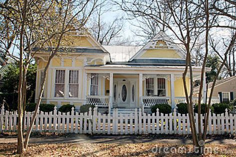 Yellow Victorian Houses | Yellow one-story Victorian style home with a white picket fence. Yellow Victorian House, White Victorian House, Folk Victorian House, Farmhouse Victorian, White Pic, Victorian Exterior, Victorian Style House, Folk Victorian, Victorian Style Homes