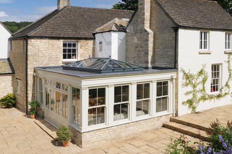 This good sized orangery with vertical sliding sash windows was designed to create a light living room with a fireplace, to be used as a casual family room all year round. Do you think it did the job!?    #MondayMotivation #orangeries #conservatories #bespoke #design  01278 764 444  sales@davidsalisbury.com Orangery Extension Kitchen, Orangery Interior, Extension Roof, Attached Greenhouse, Orangery Roof, Kitchen Orangery, Roof Lanterns, Orangery Conservatory, Modern Conservatory