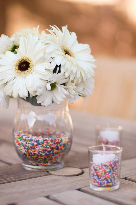 At the Sprinkles birthday party, I used sprinkles everywhere.  Everywhere. Soooo many sprinkles.  I had this vision of vases filled with sprinkles, overflowing with bountiful blooms. Sprinkles Birthday Party, Sprinkle Shower, Sprinkle Party, Birthday Party Centerpieces, Sprinkle Baby Shower, Donut Party, Shower Centerpieces, Diy Centerpieces