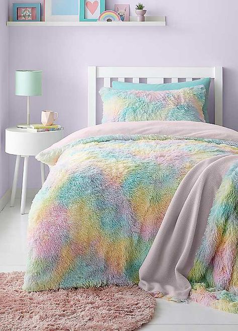 Drift into a world of soft, cuddly comfort with our pastel dreams faux fur bedding. This set is a haven of tranquillity with its plush faux fur and soothing ombre pastel colours that blend from a serene pink to a calming aqua, creating a peaceful ambiance in any bedroom. Catherine Lansfield is renowned for style and quality - designed and developed in Great Britain. Brand: Catherine Lansfield Warm & Cosy: To make those colder nights extra toasty Soft and Comfortable: Feeling gentle on the skin for a relaxed space Button Fastening: To keep your duvet securely in place Duvet set comprises of duvet cover and pillowcase(s), one with the single and two with the double and king Wash before use Machine wash at 40 degrees Tumble dry safe 100% Polyester Faux Fur Bedding, Fur Bedding, Christmas Furniture, Catherine Lansfield, Bed Curtains, Bed Sets, Garden Bedding, Pink Kids, Home Decor Lights