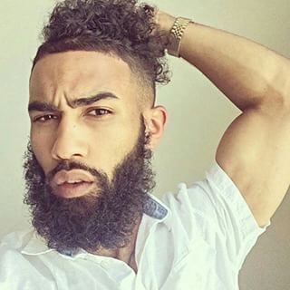 If a man with a head full of hair isn’t enough, consider one with a chin full, too. | 27 Gorgeous Guys Who Are #TeamNatural Natural Hair Men, Beard Game, Black Men Haircuts, Natural Man, Pelo Afro, Black Men Hairstyles, Corte De Cabelo Masculino, Hair And Beard Styles, Beard Styles