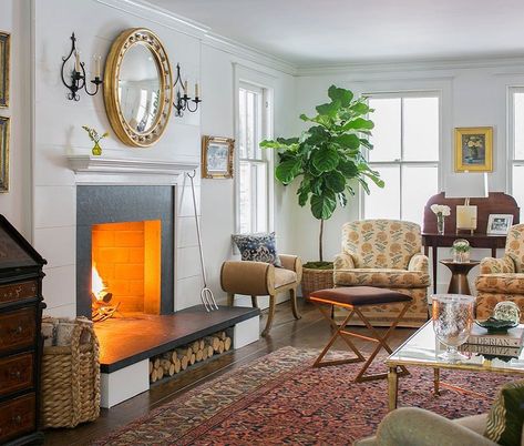 Such an inviting room by Carol Flanagan Interior Design. Love the firewood storage--Nice to see our Sophia sconces too! @carolflandesigns ⠀ #handforgediron #livingroomstyle #sconces #handfinished #customlighing #sconce #lightinginspo #handforged #ironware #ironwareinternational #handfinished #blacksmith #greenwichct #artisans #fireplacestyle #madeinfrance🇫🇷 Ironware International (@ironwareinternational) • Instagram photos and videos Fireplace Style, Made Bed, Room Styling, Live In Style, Brown Furniture, Vintage Blanket, Comfy Chairs, Decoration Inspiration, Living Room Colors